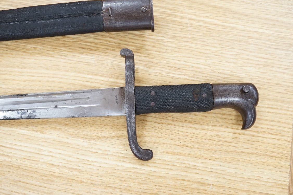 A Prussian M1865 bayonet and scabbard, blade marked with A&AS (for August & Albert Schnitzier), and Wilhelm I crown